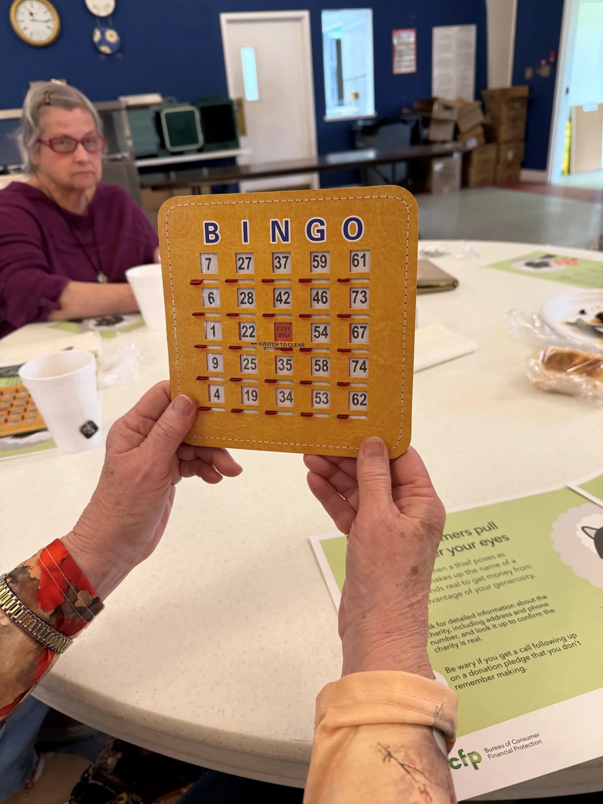 person holding a bingo card
